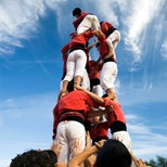 shows people building a tower together